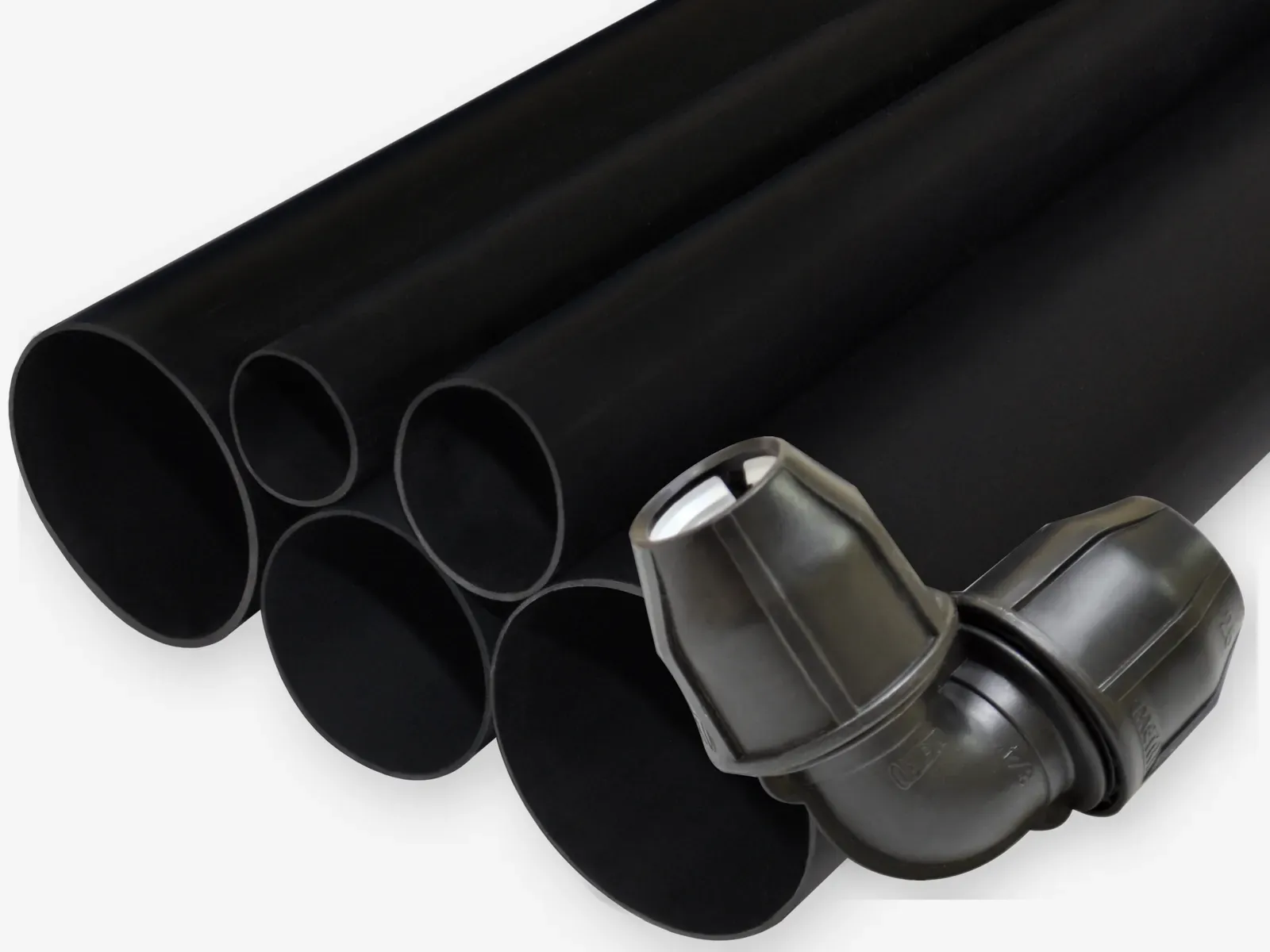 Black HDPE pipes with a Metro compression elbow fitting